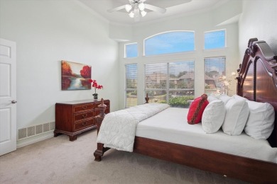 Situated on an oversized waterfront lot within the zero lot line on Hackberry Creek Country Club in Texas - for sale on GolfHomes.com, golf home, golf lot