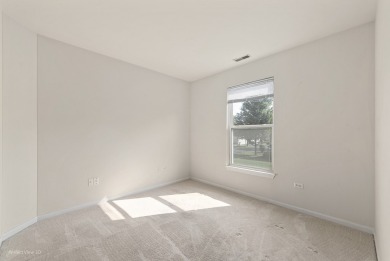 This lovely second floor condo in a secure building features 2 on The Links at Carillon in Illinois - for sale on GolfHomes.com, golf home, golf lot