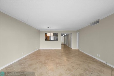 Experience the best of Florida living in this stunning home on Palm-Aire Country Club and Resort - Palms in Florida - for sale on GolfHomes.com, golf home, golf lot