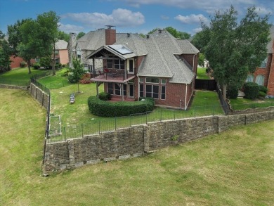 Situated on an oversized waterfront lot within the zero lot line on Hackberry Creek Country Club in Texas - for sale on GolfHomes.com, golf home, golf lot