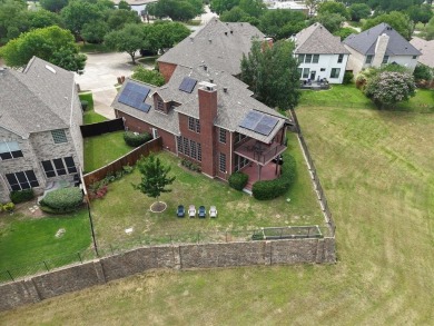 Situated on an oversized waterfront lot within the zero lot line on Hackberry Creek Country Club in Texas - for sale on GolfHomes.com, golf home, golf lot