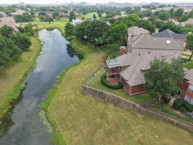 Situated on an oversized waterfront lot within the zero lot line on Hackberry Creek Country Club in Texas - for sale on GolfHomes.com, golf home, golf lot