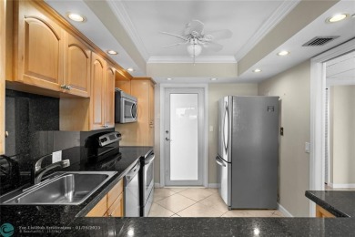 Experience the best of Florida living in this stunning home on Palm-Aire Country Club and Resort - Palms in Florida - for sale on GolfHomes.com, golf home, golf lot