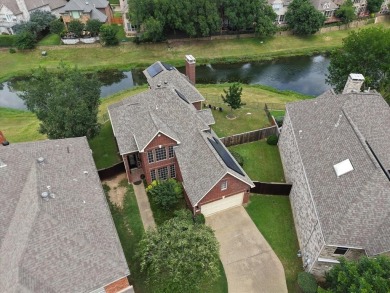Situated on an oversized waterfront lot within the zero lot line on Hackberry Creek Country Club in Texas - for sale on GolfHomes.com, golf home, golf lot