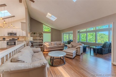 Located in the iconic Tan Tar A Estates, just steps from on The Oaks Golf Course in Missouri - for sale on GolfHomes.com, golf home, golf lot