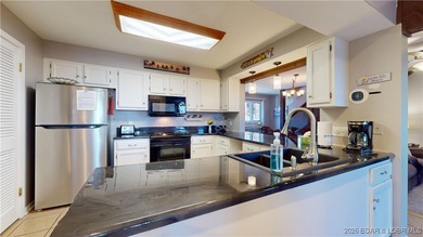 LAKE OF THE OZARKS | TOP-FLOOR CONDOMINIUM Enjoy breathtaking on The Oaks Golf Course in Missouri - for sale on GolfHomes.com, golf home, golf lot