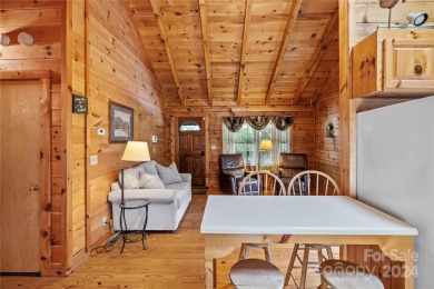 Welcome to your dream cabin nestled in the highly sought-after on Rumbling Bald Resort on Lake Lure in North Carolina - for sale on GolfHomes.com, golf home, golf lot