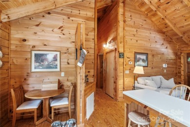 Welcome to your dream cabin nestled in the highly sought-after on Rumbling Bald Resort on Lake Lure in North Carolina - for sale on GolfHomes.com, golf home, golf lot