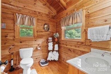 Welcome to your dream cabin nestled in the highly sought-after on Rumbling Bald Resort on Lake Lure in North Carolina - for sale on GolfHomes.com, golf home, golf lot