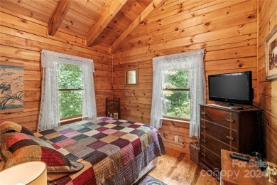 Welcome to your dream cabin nestled in the highly sought-after on Rumbling Bald Resort on Lake Lure in North Carolina - for sale on GolfHomes.com, golf home, golf lot