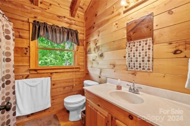 Welcome to your dream cabin nestled in the highly sought-after on Rumbling Bald Resort on Lake Lure in North Carolina - for sale on GolfHomes.com, golf home, golf lot