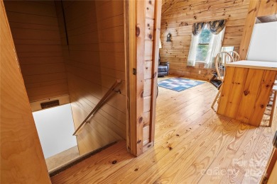 Welcome to your dream cabin nestled in the highly sought-after on Rumbling Bald Resort on Lake Lure in North Carolina - for sale on GolfHomes.com, golf home, golf lot