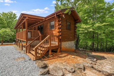 Welcome to your dream cabin nestled in the highly sought-after on Rumbling Bald Resort on Lake Lure in North Carolina - for sale on GolfHomes.com, golf home, golf lot