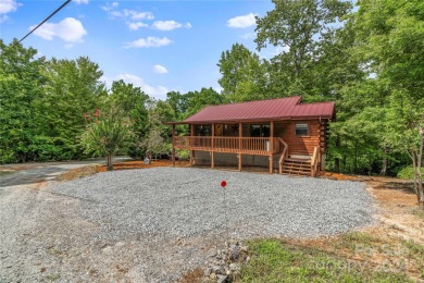 Welcome to your dream cabin nestled in the highly sought-after on Rumbling Bald Resort on Lake Lure in North Carolina - for sale on GolfHomes.com, golf home, golf lot