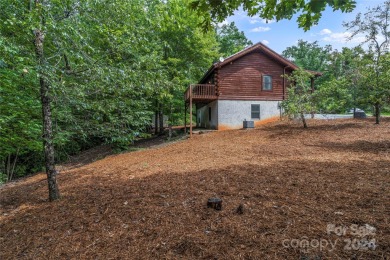 Welcome to your dream cabin nestled in the highly sought-after on Rumbling Bald Resort on Lake Lure in North Carolina - for sale on GolfHomes.com, golf home, golf lot