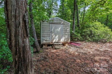 Welcome to your dream cabin nestled in the highly sought-after on Rumbling Bald Resort on Lake Lure in North Carolina - for sale on GolfHomes.com, golf home, golf lot