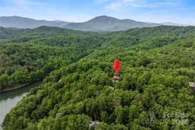 Welcome to your dream cabin nestled in the highly sought-after on Rumbling Bald Resort on Lake Lure in North Carolina - for sale on GolfHomes.com, golf home, golf lot