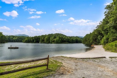 Welcome to your dream cabin nestled in the highly sought-after on Rumbling Bald Resort on Lake Lure in North Carolina - for sale on GolfHomes.com, golf home, golf lot