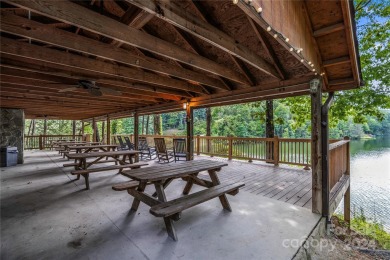 Welcome to your dream cabin nestled in the highly sought-after on Rumbling Bald Resort on Lake Lure in North Carolina - for sale on GolfHomes.com, golf home, golf lot