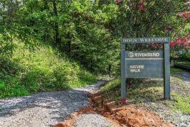 Welcome to your dream cabin nestled in the highly sought-after on Rumbling Bald Resort on Lake Lure in North Carolina - for sale on GolfHomes.com, golf home, golf lot