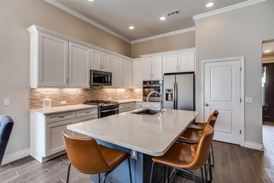 Impeccably maintained, this Briscoe floor plan offers the on Wildhorse Golf Club of Robson Ranch in Texas - for sale on GolfHomes.com, golf home, golf lot