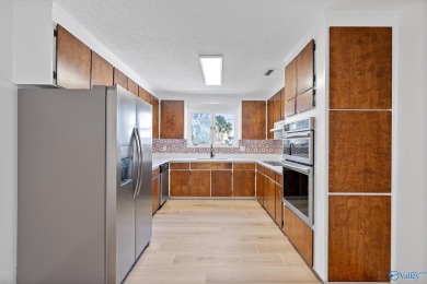 Stylish mid-century modern on a prime corner lot in vibrant on Point Mallard Golf Course in Alabama - for sale on GolfHomes.com, golf home, golf lot