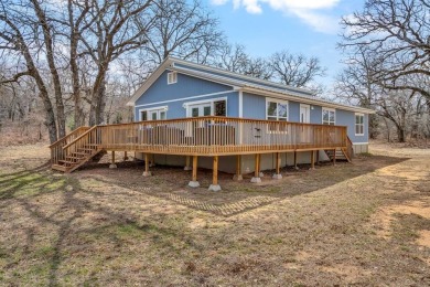 Water view home with waterfront adjacent lot in the master on Nocona Hills Golf Course in Texas - for sale on GolfHomes.com, golf home, golf lot