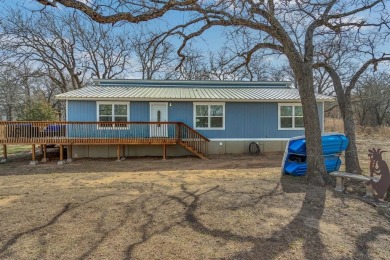 Water view home with waterfront adjacent lot in the master on Nocona Hills Golf Course in Texas - for sale on GolfHomes.com, golf home, golf lot