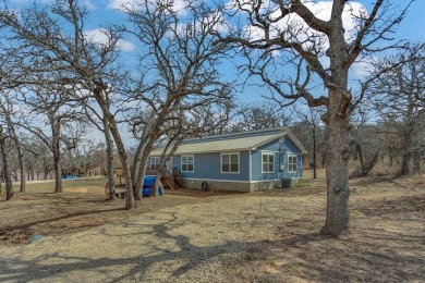 Water view home with waterfront adjacent lot in the master on Nocona Hills Golf Course in Texas - for sale on GolfHomes.com, golf home, golf lot