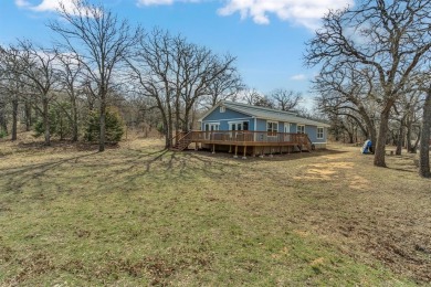 Water view home with waterfront adjacent lot in the master on Nocona Hills Golf Course in Texas - for sale on GolfHomes.com, golf home, golf lot