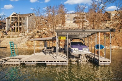 Set along the gorgeous shoreline of Lake of the Ozarks, this on Bayview Golf Course in Missouri - for sale on GolfHomes.com, golf home, golf lot