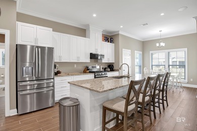 Discover exceptional coastal living in this stunning 3-bedroom on Peninsula Golf and Racquet Club in Alabama - for sale on GolfHomes.com, golf home, golf lot