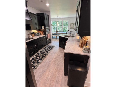 This beautifully maintained 4-bedroom, 2-bathroom home built was on Branchwood Golf Course in Arkansas - for sale on GolfHomes.com, golf home, golf lot