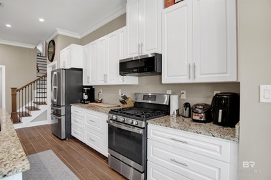 Discover exceptional coastal living in this stunning 3-bedroom on Peninsula Golf and Racquet Club in Alabama - for sale on GolfHomes.com, golf home, golf lot