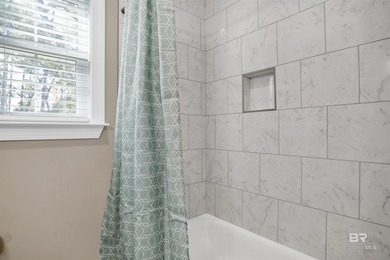 Discover exceptional coastal living in this stunning 3-bedroom on Peninsula Golf and Racquet Club in Alabama - for sale on GolfHomes.com, golf home, golf lot