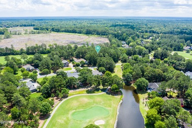 Residential parcel with mature trees set along the 3rd fairway on River Landing Golf Course in North Carolina - for sale on GolfHomes.com, golf home, golf lot