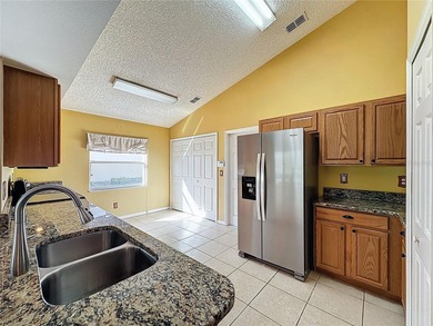 Canterbury model on a sloped golf course lot. that is heading to on Kings Ridge Golf Club in Florida - for sale on GolfHomes.com, golf home, golf lot