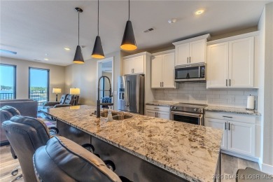 This newly constructed condo at Mile Marker 13 is an ideal on Seasons Ridge At Four Seasons in Missouri - for sale on GolfHomes.com, golf home, golf lot