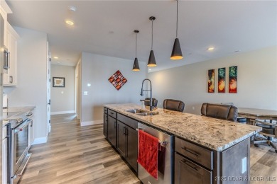 This newly constructed condo at Mile Marker 13 is an ideal on Seasons Ridge At Four Seasons in Missouri - for sale on GolfHomes.com, golf home, golf lot