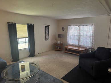 Check out this cute 2 BED 2 BATH double wide manufactured home on Spanish Lakes I in Florida - for sale on GolfHomes.com, golf home, golf lot