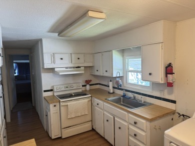 Check out this cute 2 BED 2 BATH double wide manufactured home on Spanish Lakes I in Florida - for sale on GolfHomes.com, golf home, golf lot