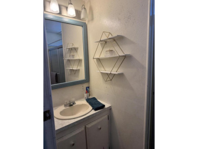 Check out this cute 2 BED 2 BATH double wide manufactured home on Spanish Lakes I in Florida - for sale on GolfHomes.com, golf home, golf lot