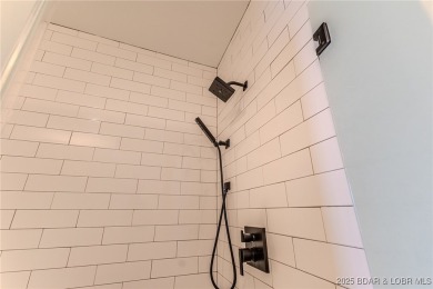 This newly constructed condo at Mile Marker 13 is an ideal on Seasons Ridge At Four Seasons in Missouri - for sale on GolfHomes.com, golf home, golf lot