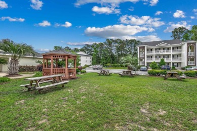 Welcome to this charming two-bedroom, two-bath condo in the on River Oaks Golf Plantation  in South Carolina - for sale on GolfHomes.com, golf home, golf lot