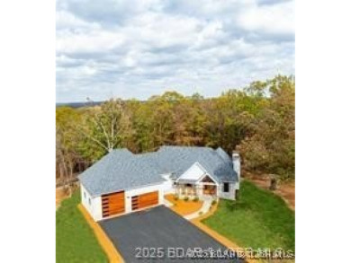 Step into the epitome of luxurious living at The Estates of on The Club At Old Kinderhook in Missouri - for sale on GolfHomes.com, golf home, golf lot