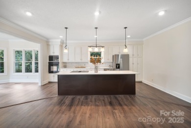 Welcome home to this stunningly remodeled 3BR/2BA residence on Rock Barn Golf and Spa in North Carolina - for sale on GolfHomes.com, golf home, golf lot