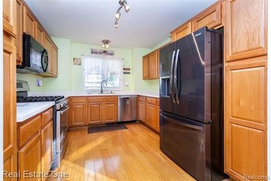 Enjoy the convenience of single level living in this beautiful on St. Clair Shores Country Club in Michigan - for sale on GolfHomes.com, golf home, golf lot