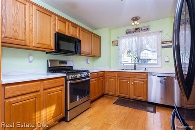 Enjoy the convenience of single level living in this beautiful on St. Clair Shores Country Club in Michigan - for sale on GolfHomes.com, golf home, golf lot