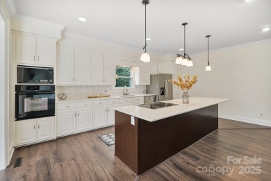 Welcome home to this stunningly remodeled 3BR/2BA residence on Rock Barn Golf and Spa in North Carolina - for sale on GolfHomes.com, golf home, golf lot