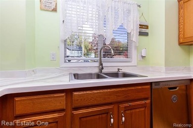 Enjoy the convenience of single level living in this beautiful on St. Clair Shores Country Club in Michigan - for sale on GolfHomes.com, golf home, golf lot